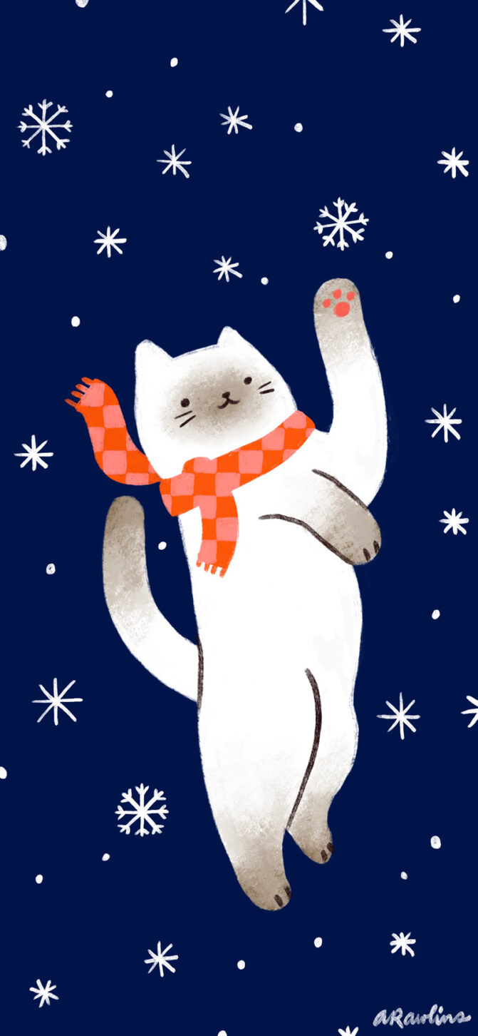 Winter siamese cat batting at a snowflake and wearing a scarf